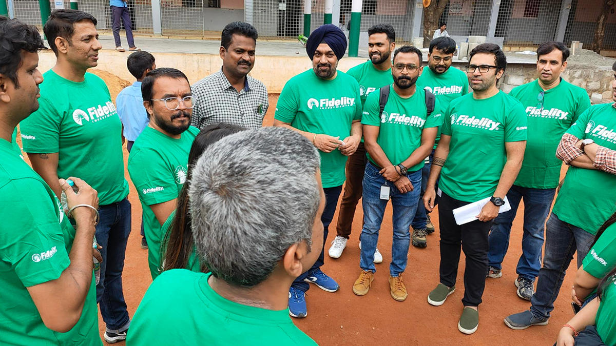 a group of men in green shirts