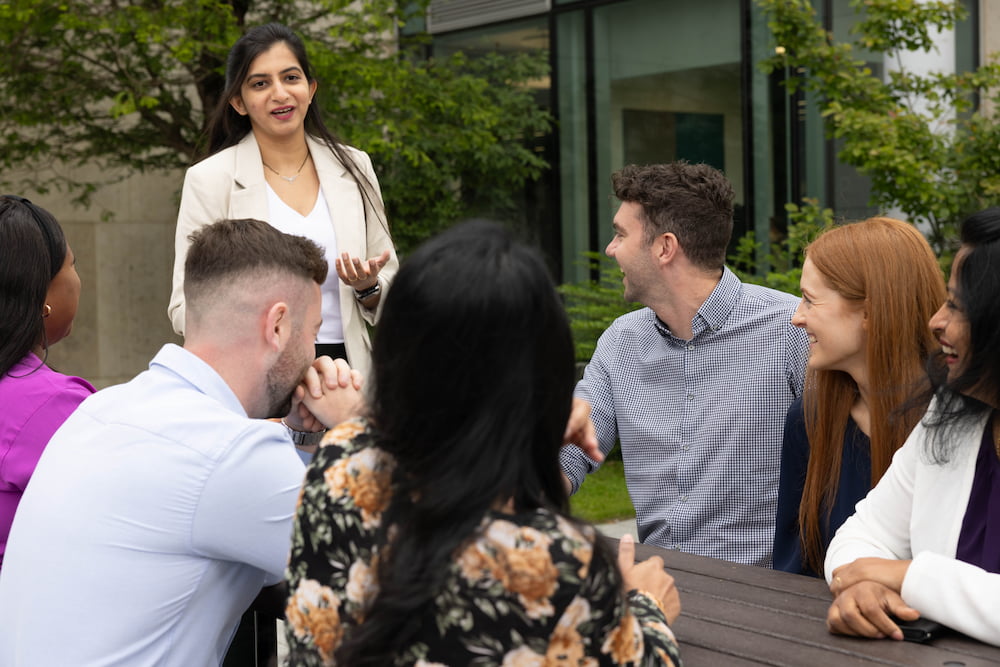 a group of people sitting around a table