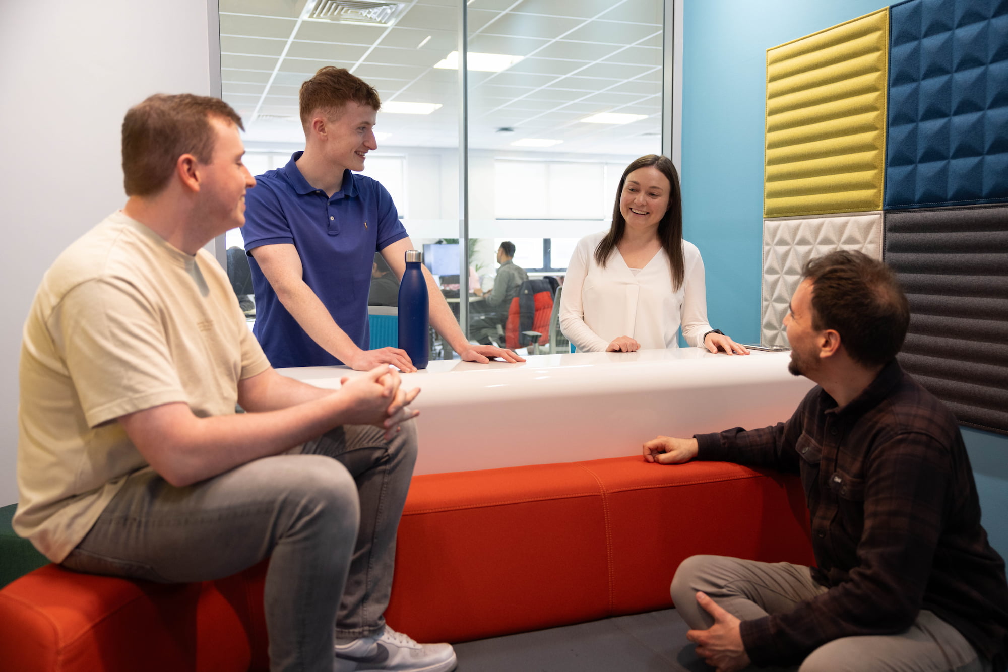 a group of people sitting around a counter