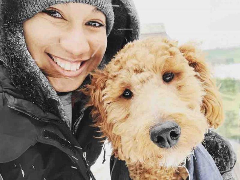 a person taking a selfie with a dog