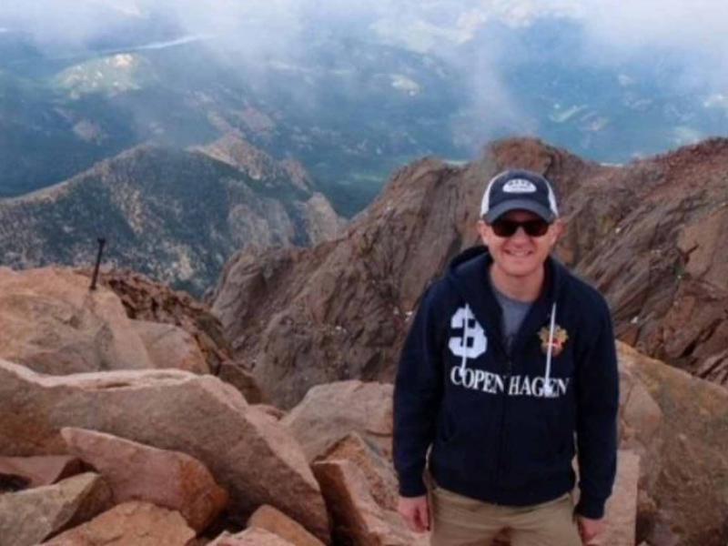 a person standing on a rocky mountain