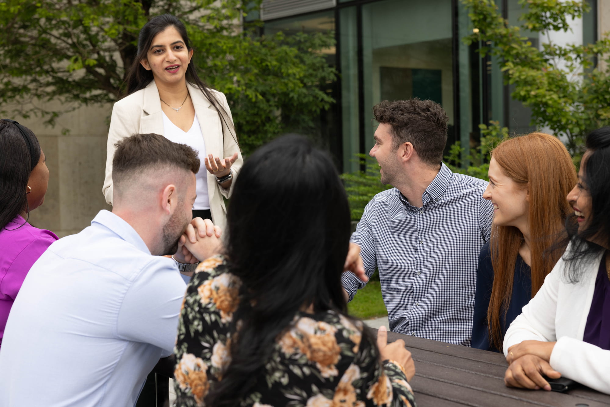 a group of people sitting around a table