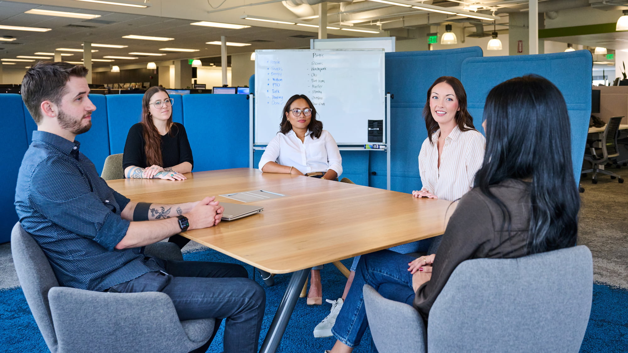a group of people sitting around a table