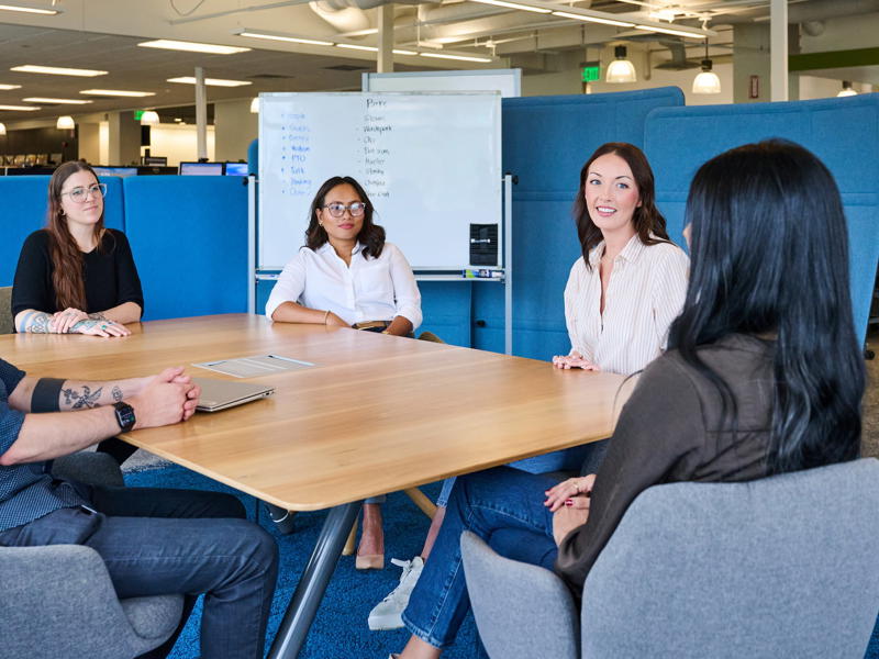 a group of people sitting around a table