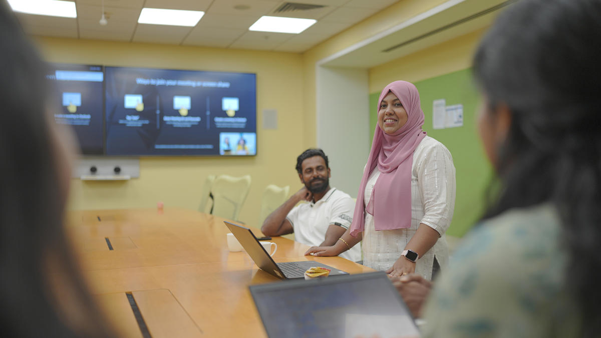 a person standing in front of a group of people