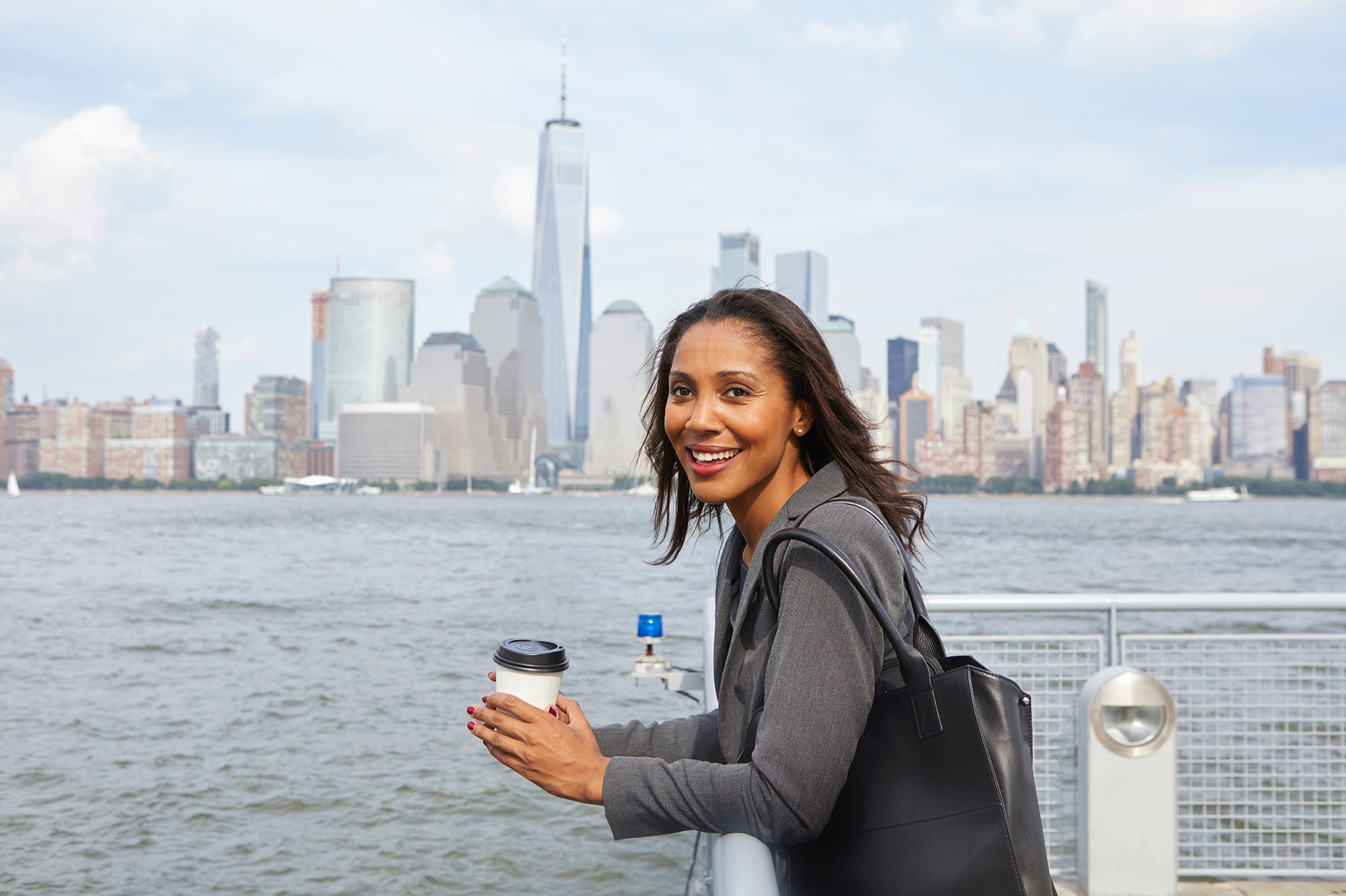 a person holding a cup of coffee