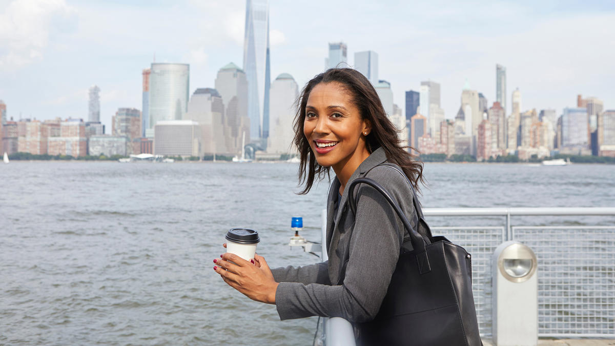 a person holding a cup of coffee