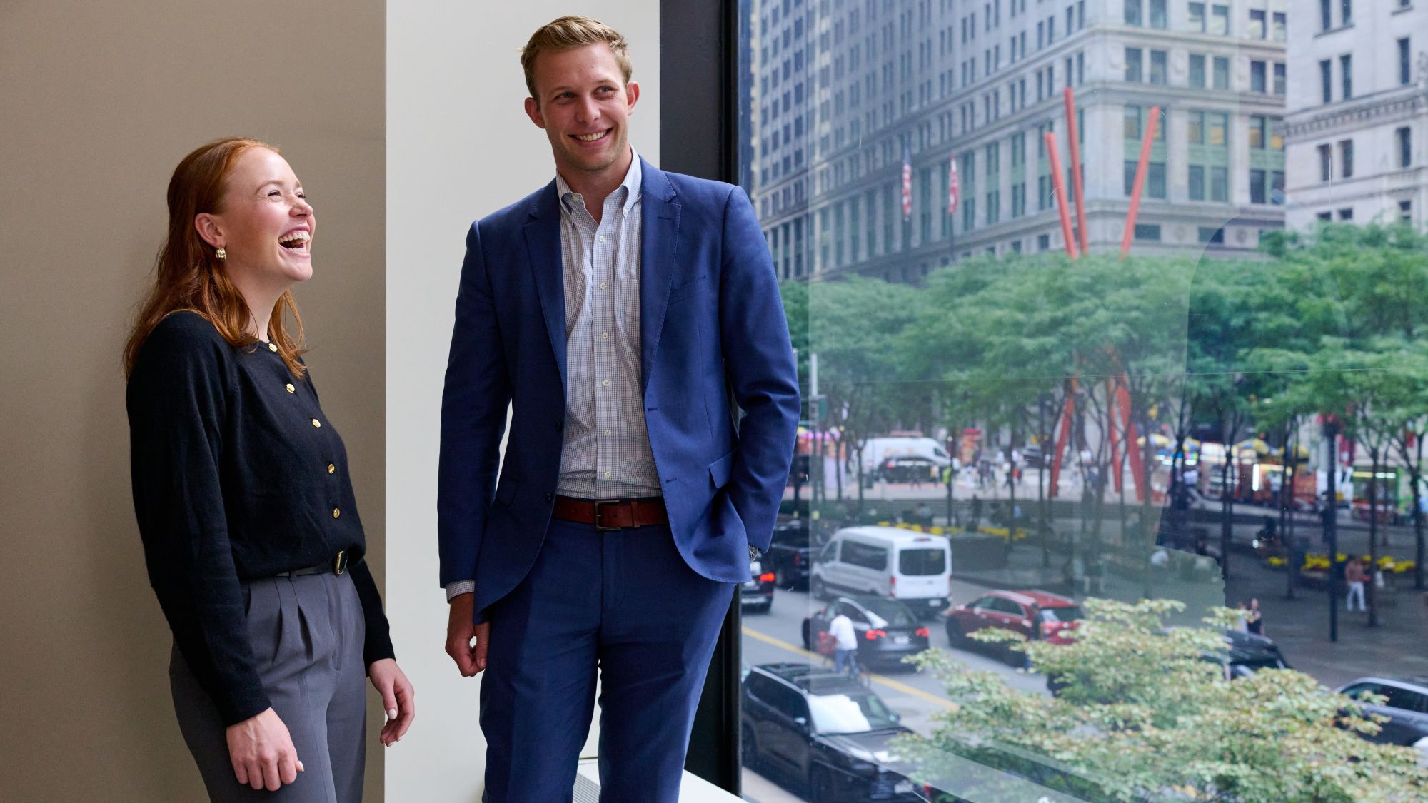 a person and person standing in front of a window