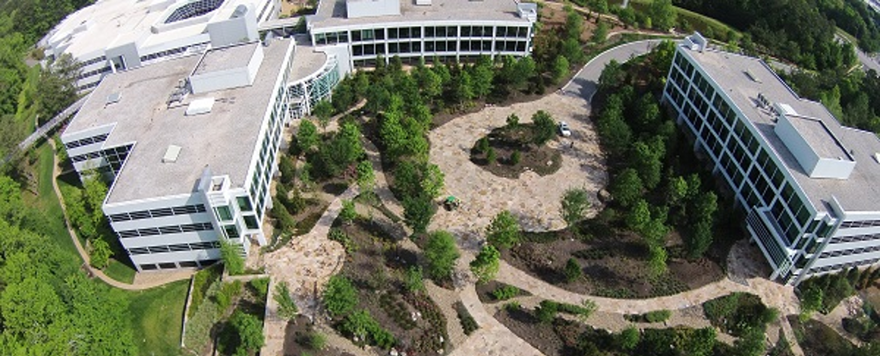 aerial view of a building with a garden