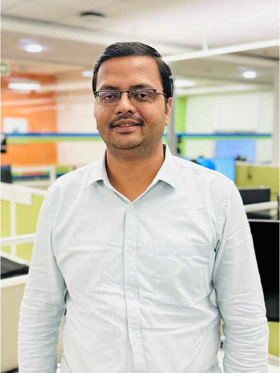 a person wearing glasses and a white shirt