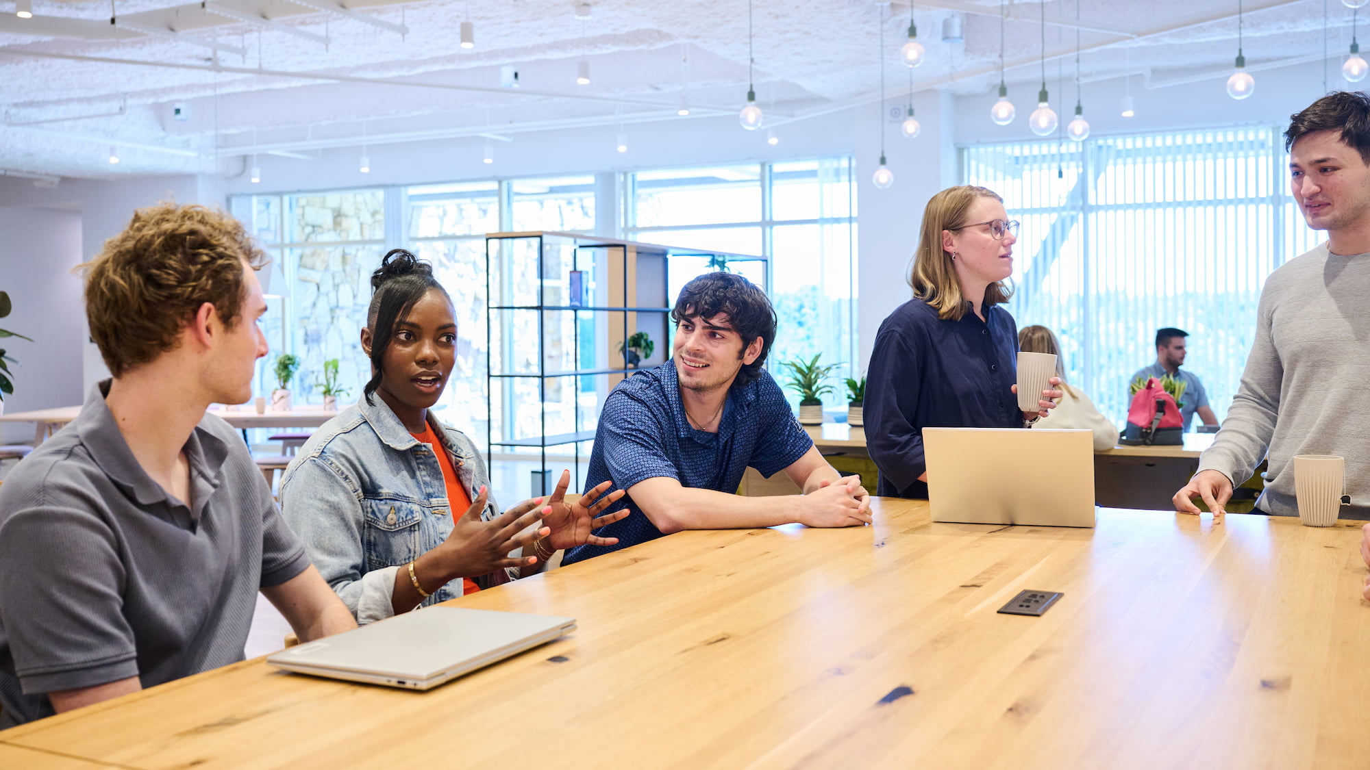 a group of people sitting around a table