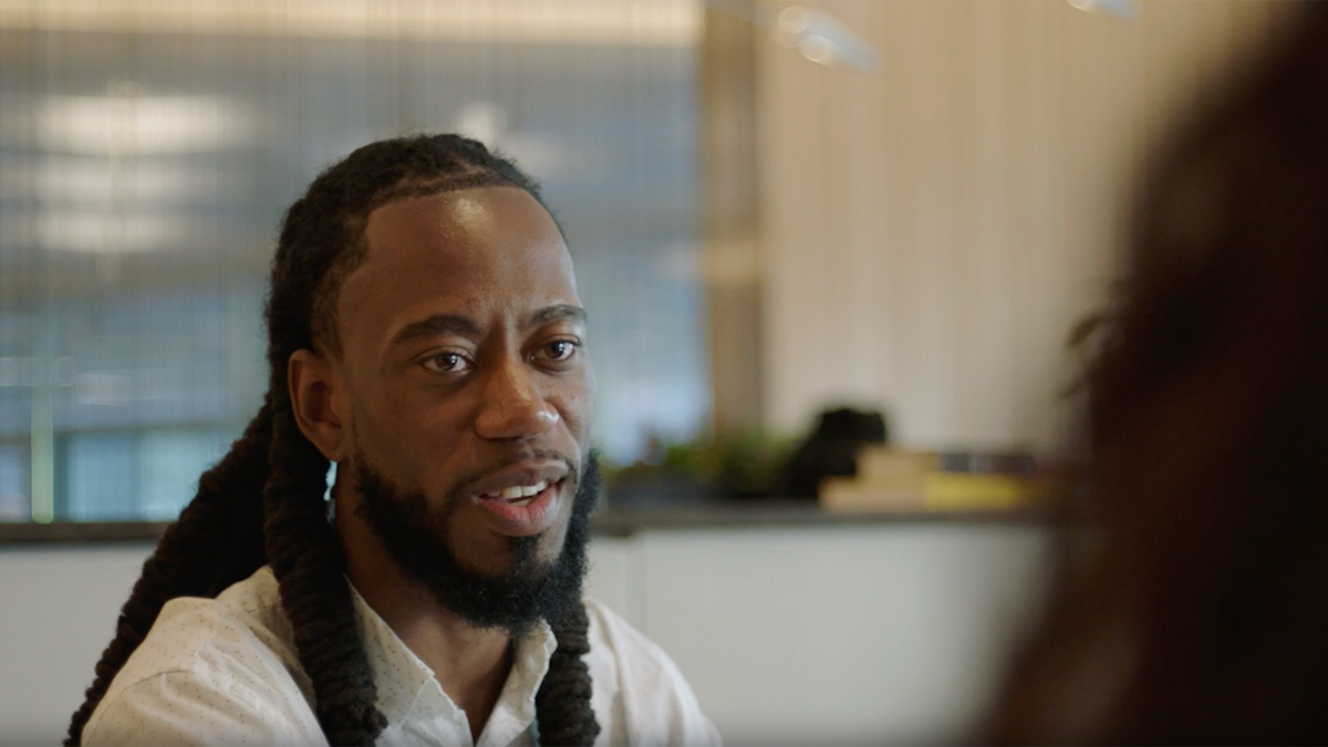 a person with a beard and braids
