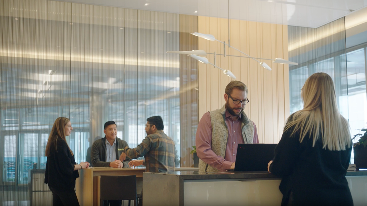 a group of people standing around a counter