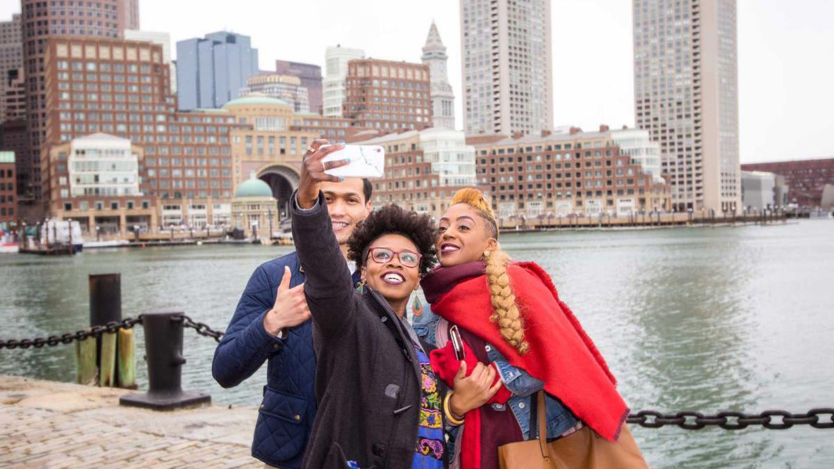 a group of people taking a selfie