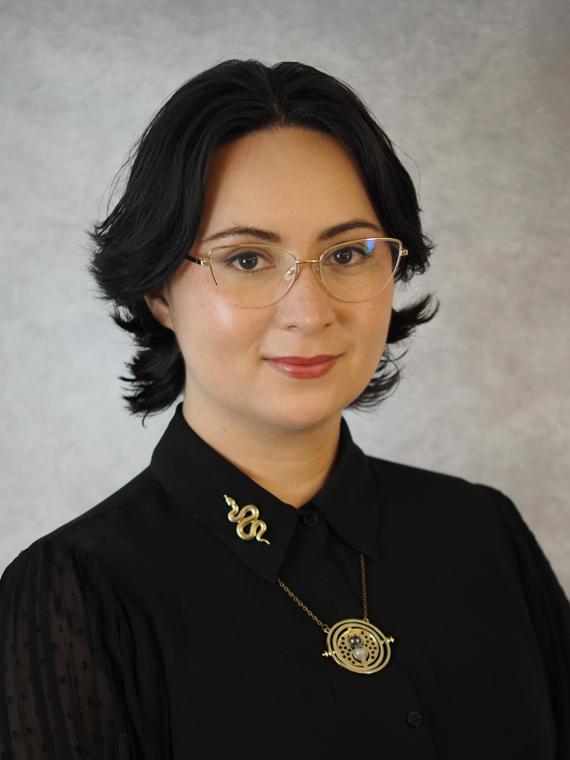 a person wearing glasses and a black shirt