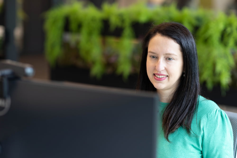 a person looking at a computer screen