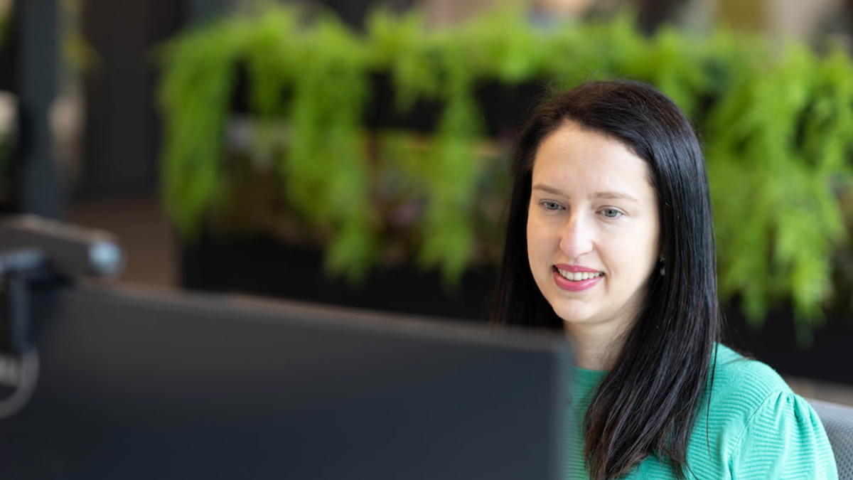a person looking at a computer screen