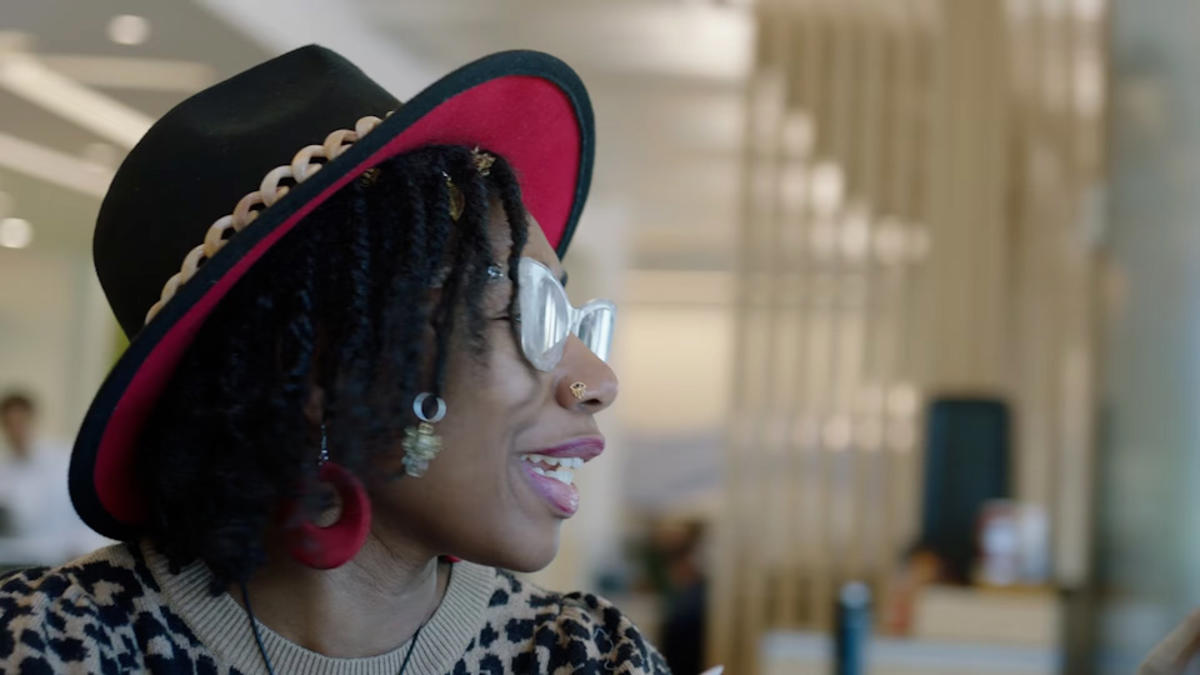 a person wearing a hat and glasses