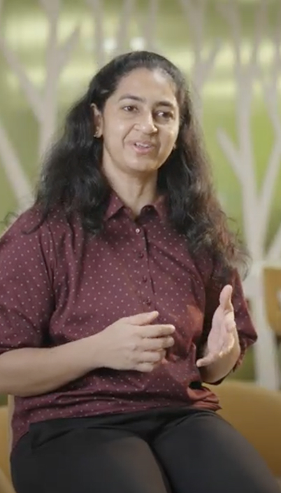 a person with long hair wearing a red shirt