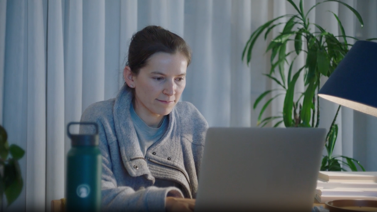 a person looking at a laptop