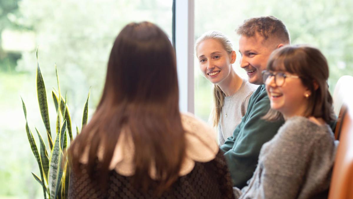 a group of people sitting in a circle