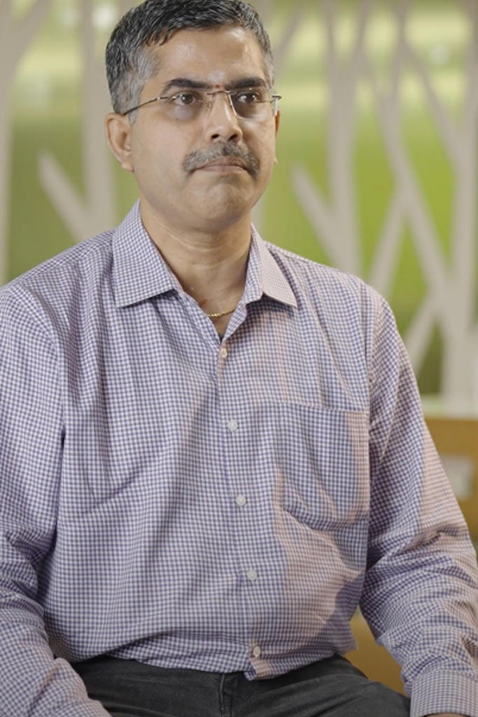 a person with a mustache and glasses
