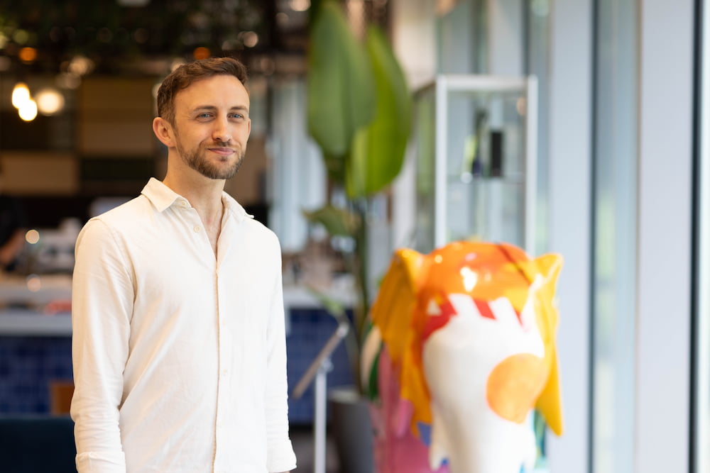 a person standing in front of a statue