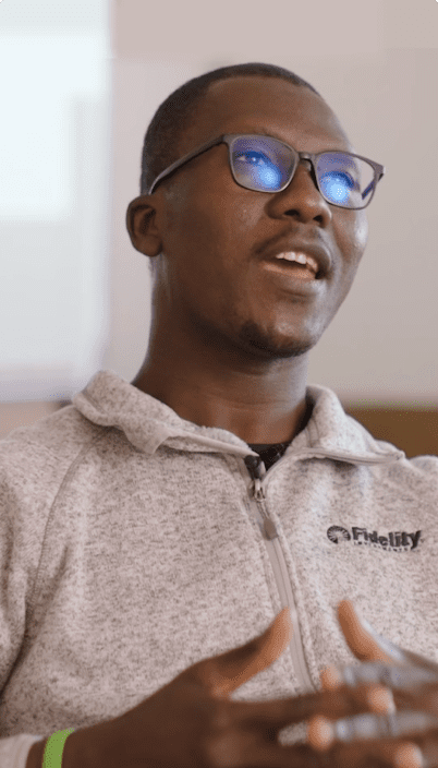 a person wearing glasses and a grey sweatshirt