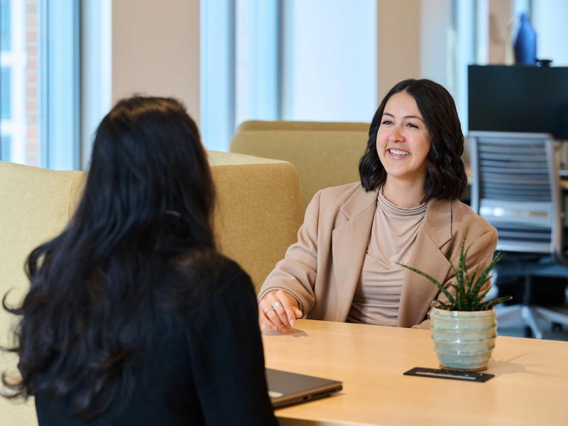 two women sitting at a table